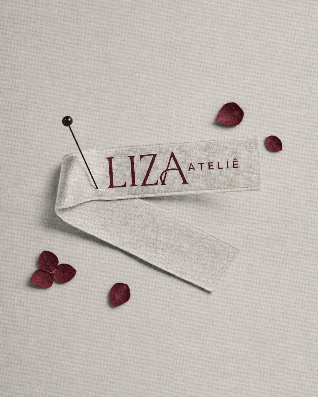 Etiqueta de tecido com o logotipo da Liza Ateliê do projeto ELISA MOREIRA
